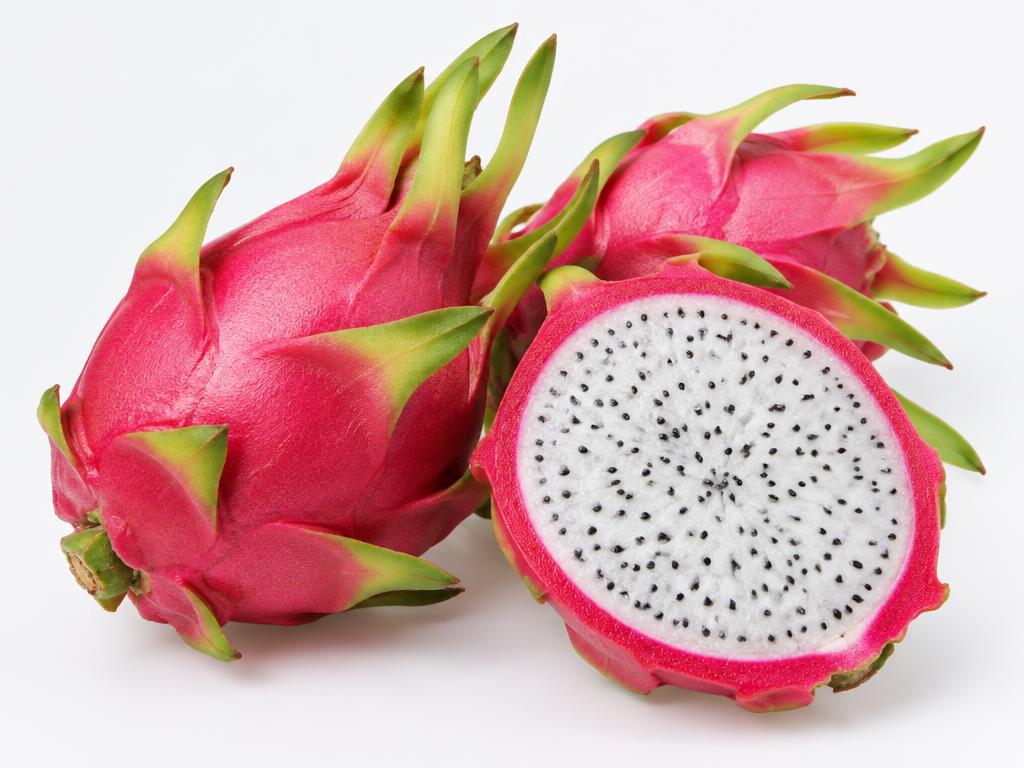 Dragon fruit with pink skin and green-tipped scales