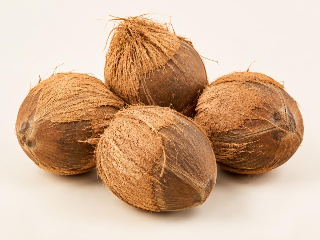 Mature semi-husked coconuts